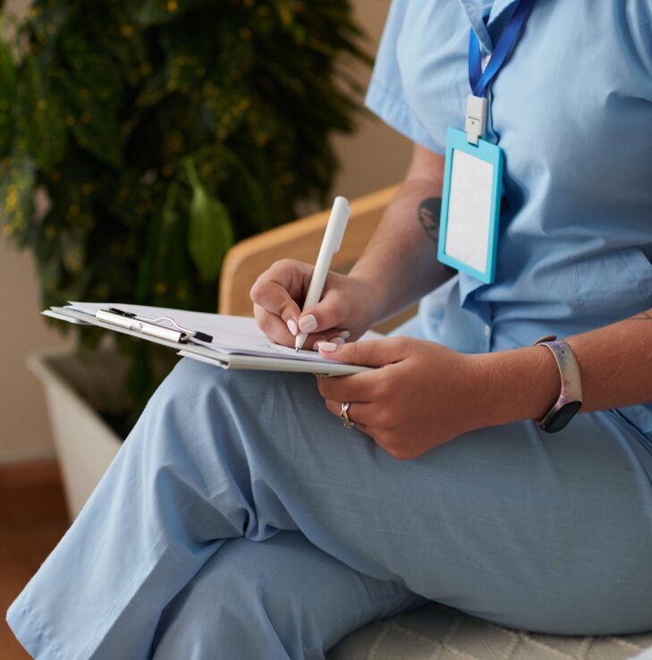 Medical worker filling document
